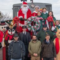 Christmas crew in front of train